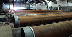 A series of pipes lined up at Dril-Quip's Aberdeen fabrication facility